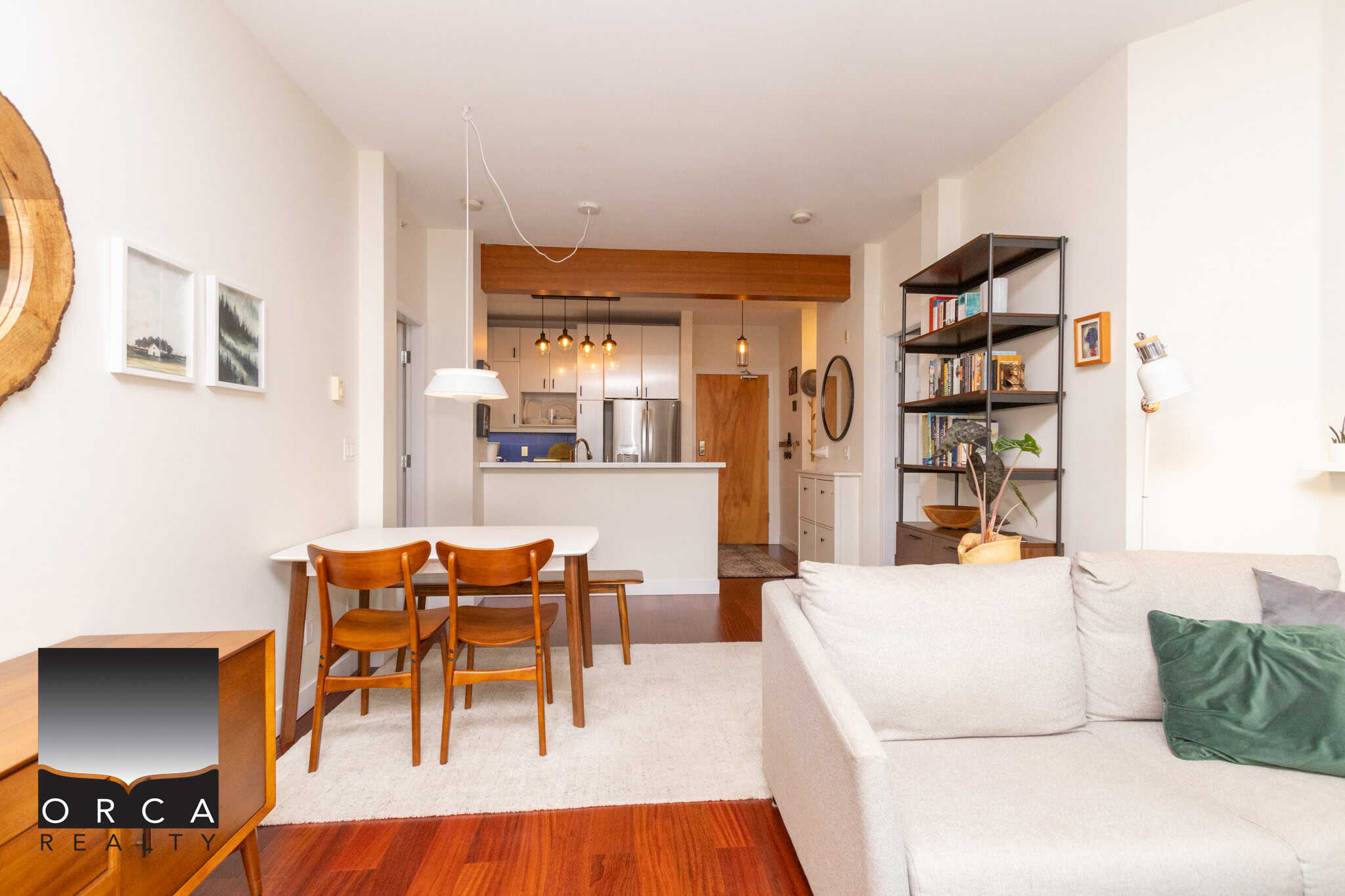 Bright and modern living room with open-concept kitchen in Vancouver, BC, featuring stylish furniture and contemporary decor, perfect for comfortable urban living.
