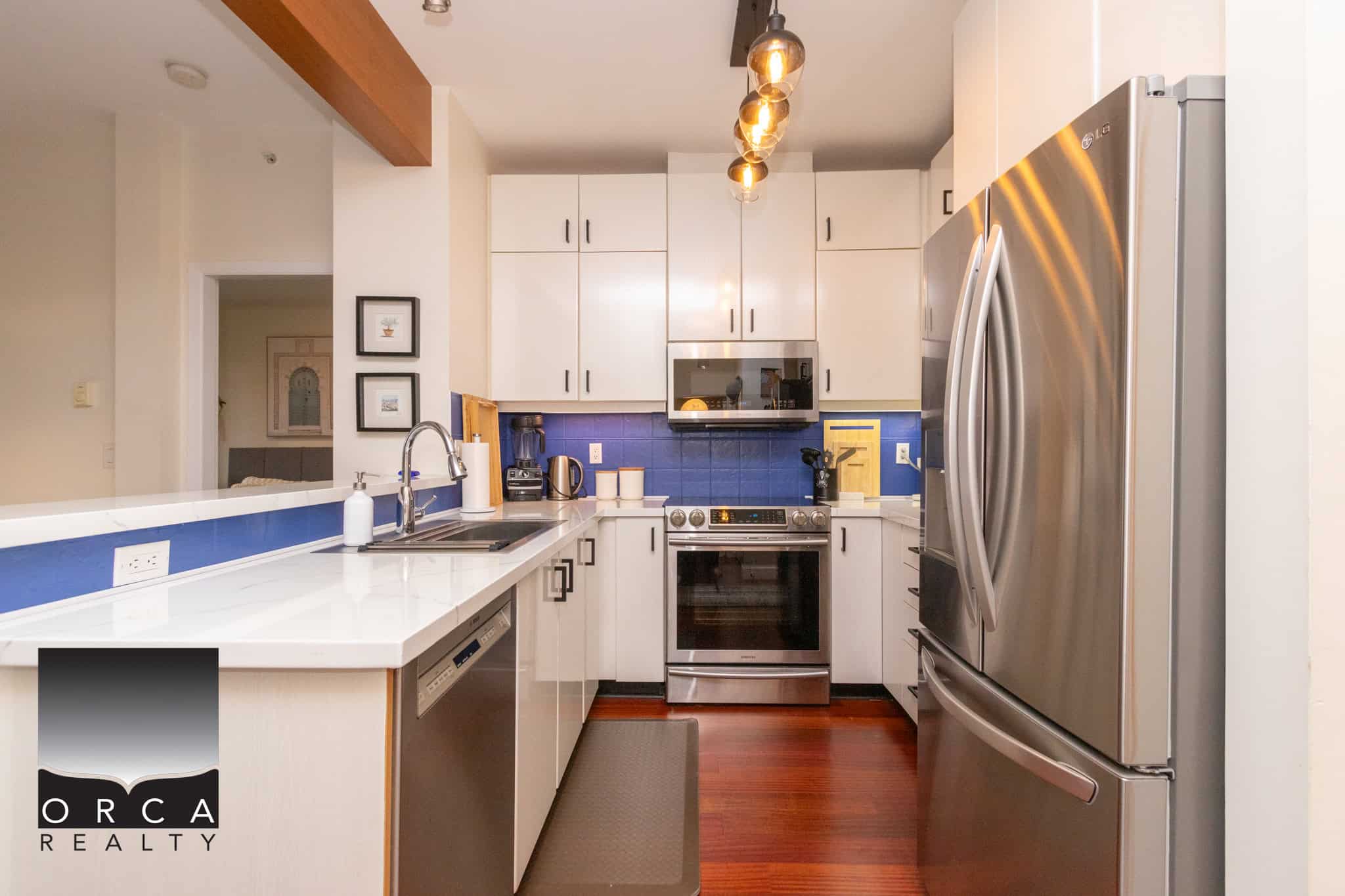 Modern Stainless Steel Refrigerator and Kitchen Appliances in a Contemporary Urban Condominiums.