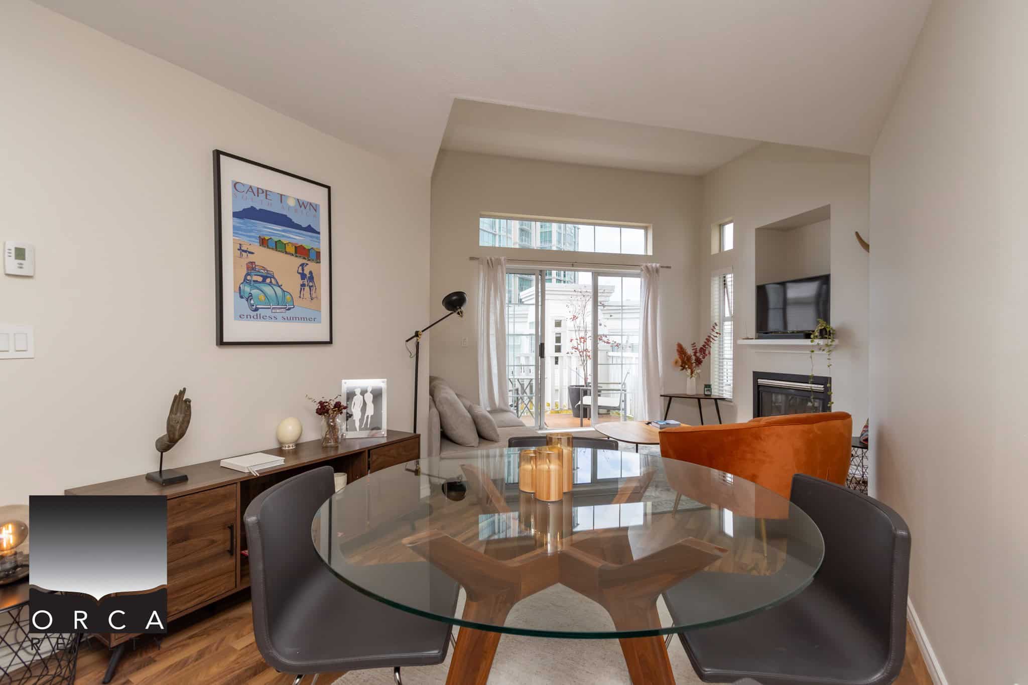Bright and modern living space interior showcasing contemporary decor, large windows offering natural light, stylish furniture, and a balcony view, perfect for Vancouver real estate.