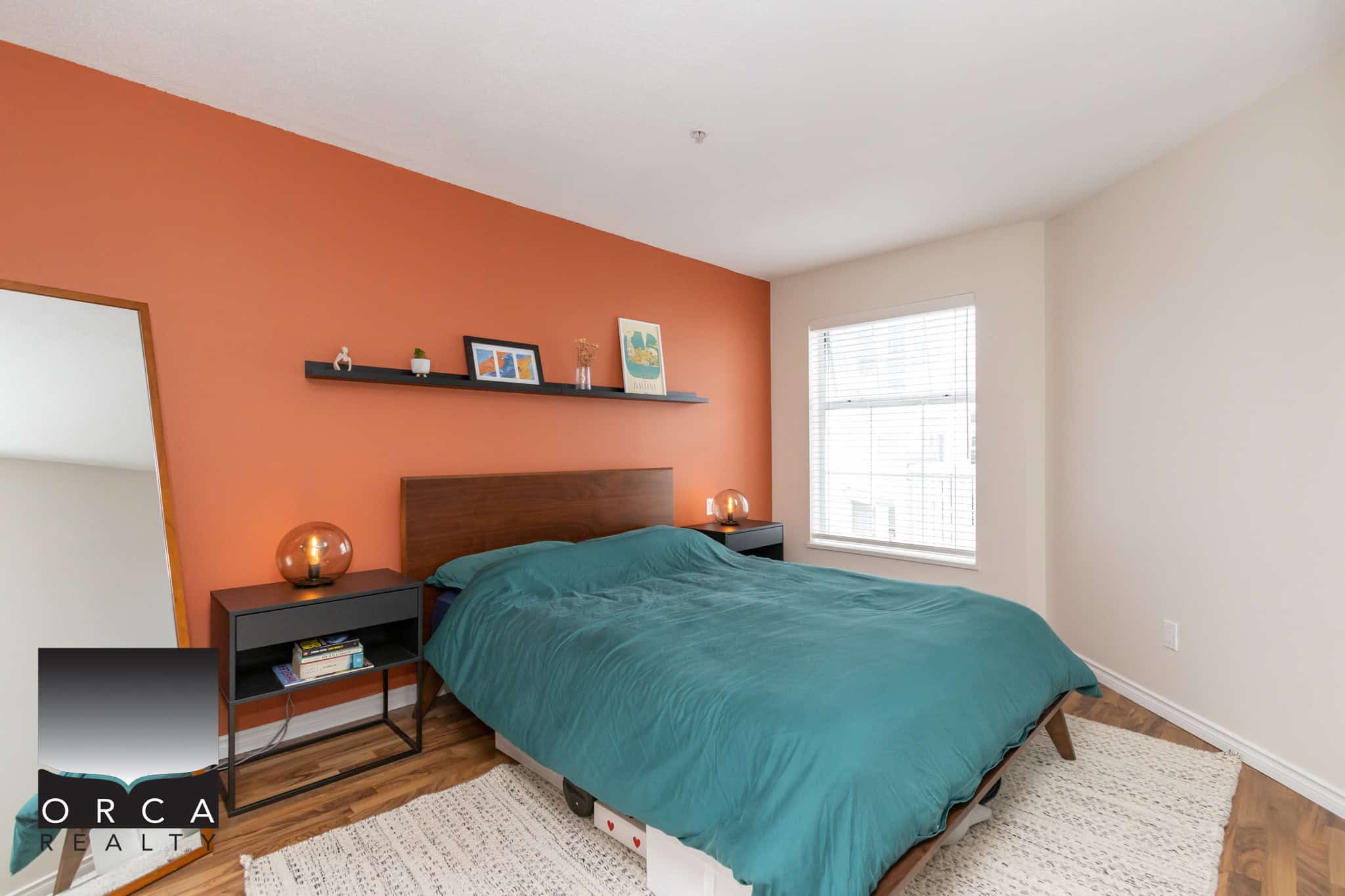 Modern living room with a cozy bed, stylish decor, and natural light, perfect for Vancouver homebuyers seeking comfortable properties in the real estate market.