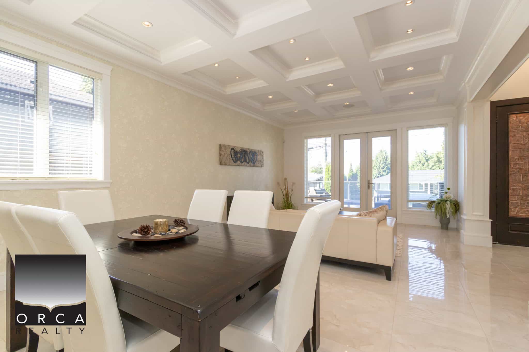 Bright and elegant dining and living room in a modern Vancouver home, featuring spacious open-concept design, high ceilings, and abundant natural light, perfect for luxury Vancouver real estate.