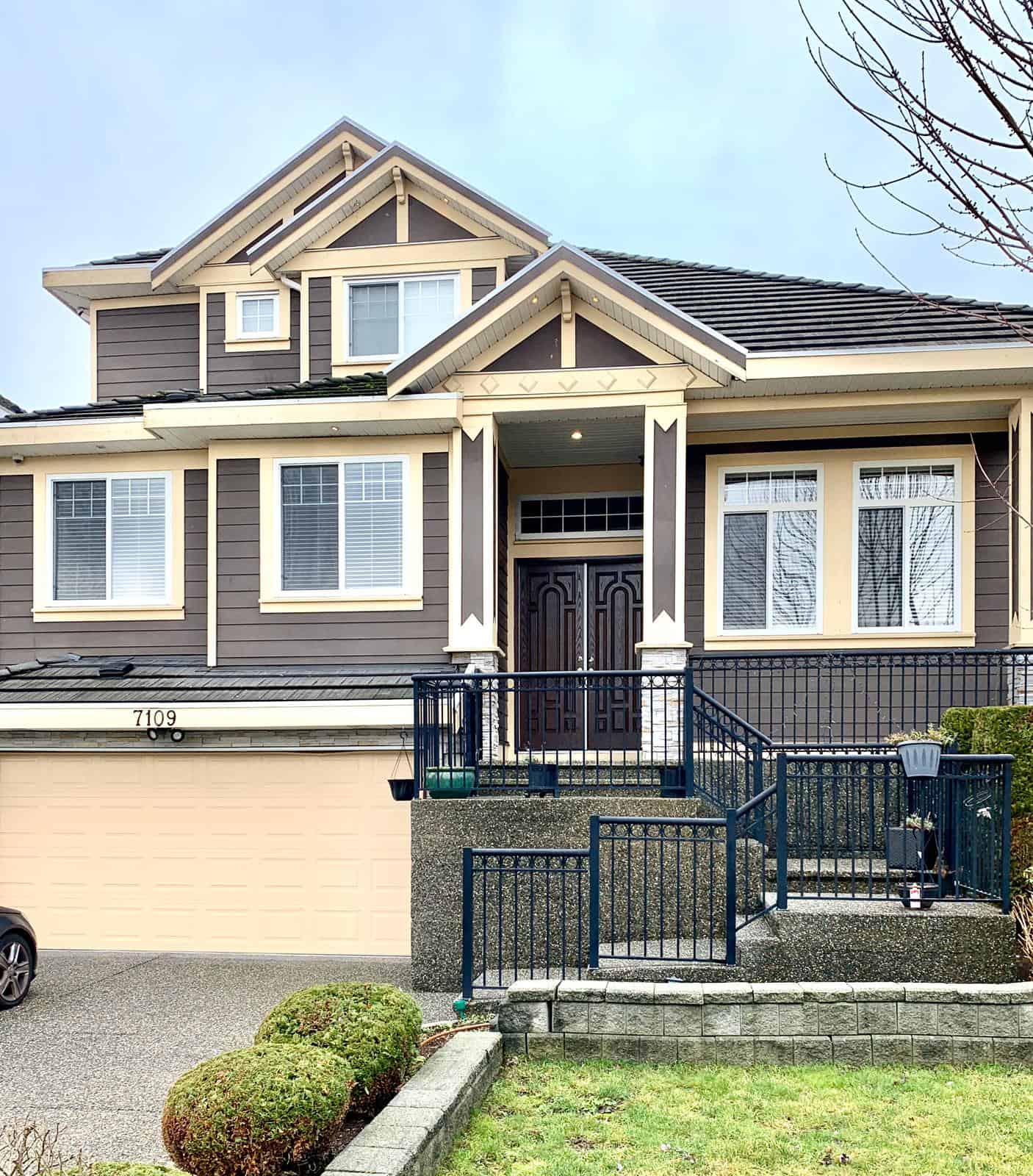 Spacious modern house exterior with a well-maintained front yard, showcasing contemporary architecture and curb appeal, ideal for real estate listings and property marketing.