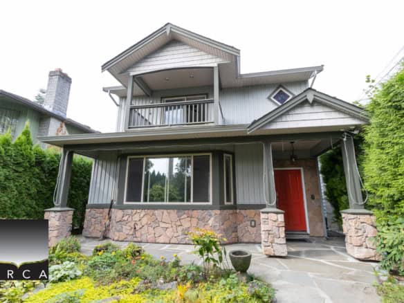Modern Vancouver home with landscaped front yard, stone accents, and a spacious porch, perfect for family living. Located in a desirable neighbourhood, close to amenities and outdoor recreation.