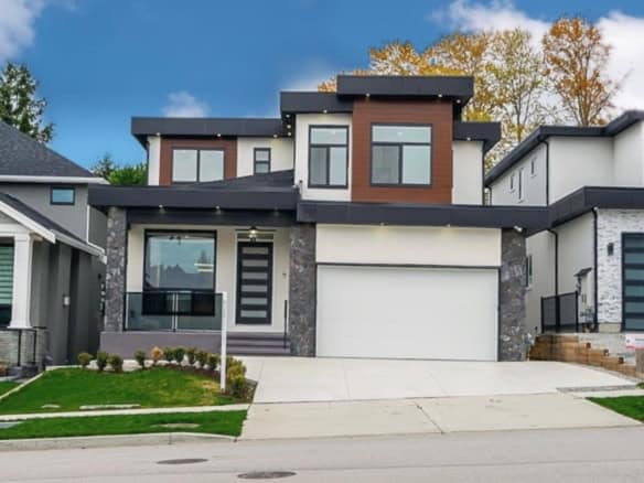 Contemporary modern house exterior showcasing stylish architecture, large windows, and a landscaped front yard, representing upscale real estate for sale or lease by Orca Realty Inc.