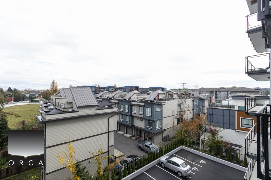 Modern multi-storey residential buildings with contemporary architecture in a vibrant Vancouver neighbourhood, offering prime investment or living opportunities through Orca Realty Inc.