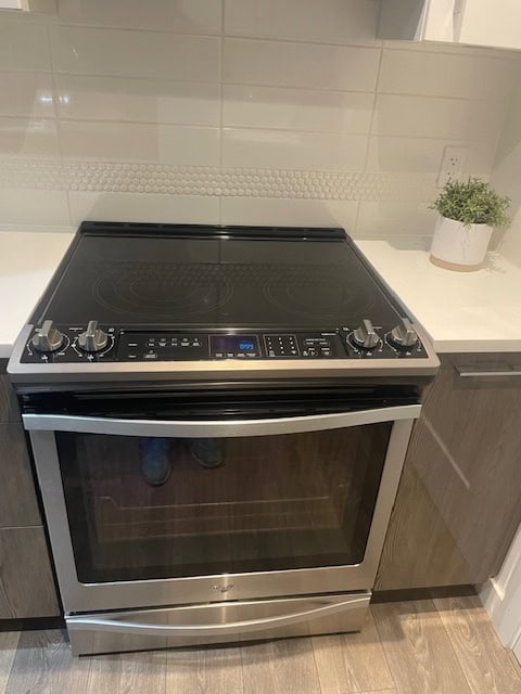 Stainless steel electric stove in a modern kitchen setting, perfect for your home cooking needs.