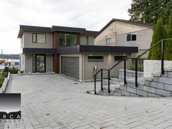 Modern contemporary house with sleek design, large windows, and expansive driveway in Vancouver, BC, ideal for real estate investment and luxurious living.