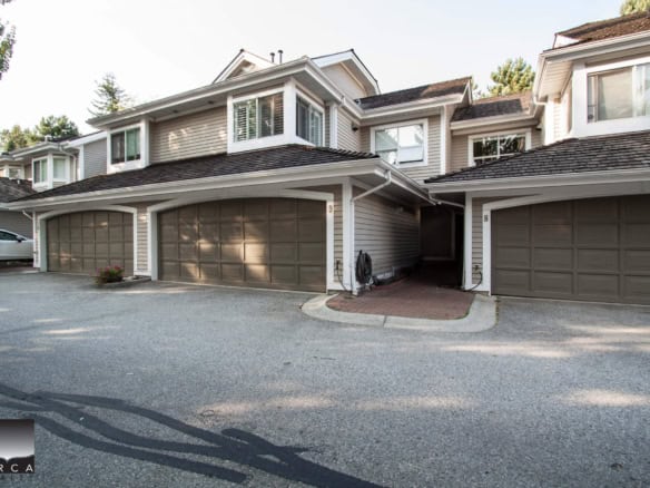 Spacious multi-family townhomes with attached garages in a family-friendly neighbourhood, featuring modern design, outdoor parking, and lush landscaping, ideal for families and investors.