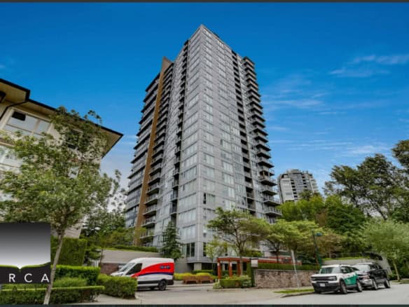 Modern high-rise condo building in Vancouver showcasing luxury urban real estate with scenic city views.