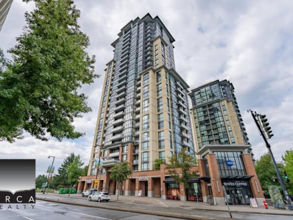 Modern luxury high-rise condo building in Victoria BC with retail spaces, including Waves Coffee, located on a vibrant city street. Ideal for real estate investments and urban living.
