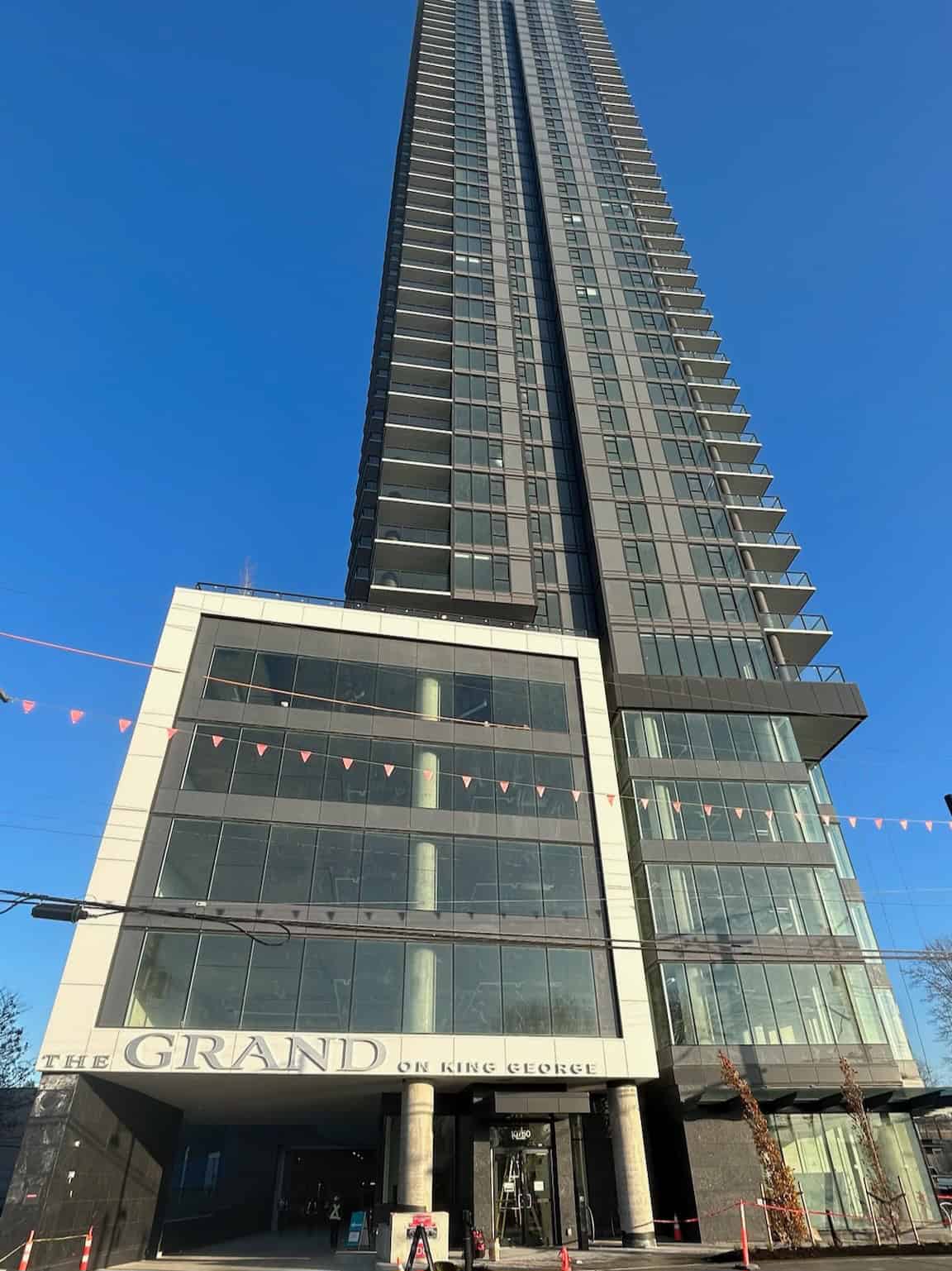Contemporary high-rise apartment building in Vancouver, BC, featuring modern architecture, glass facade, and luxurious living spaces, ideal for real estate investments and property listings.