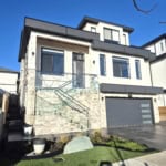 Modern contemporary house with sleek design, large windows, and a spacious driveway located in a sought-after neighbourhood in Ontario. Perfect for upscale living and real estate investment.