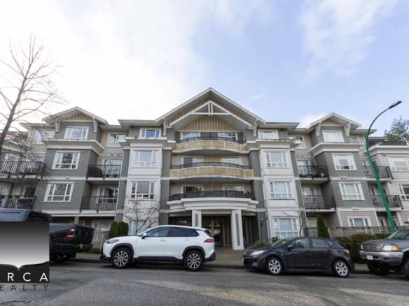 Modern multi-family residential apartment building with balconies and contemporary architectural design in Vancouver, BC, showcasing quality housing options from Orca Realty Inc.