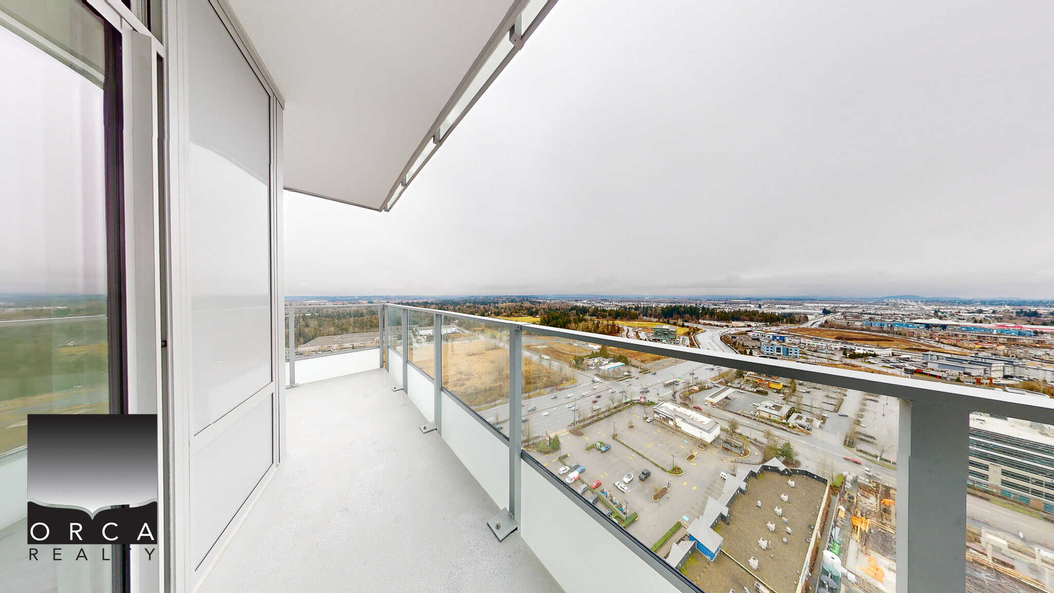 Stunning high-rise balcony with panoramic city and industrial views, ideal for urban living and entertaining in Vancouver, fully equipped with glass railing and modern design.