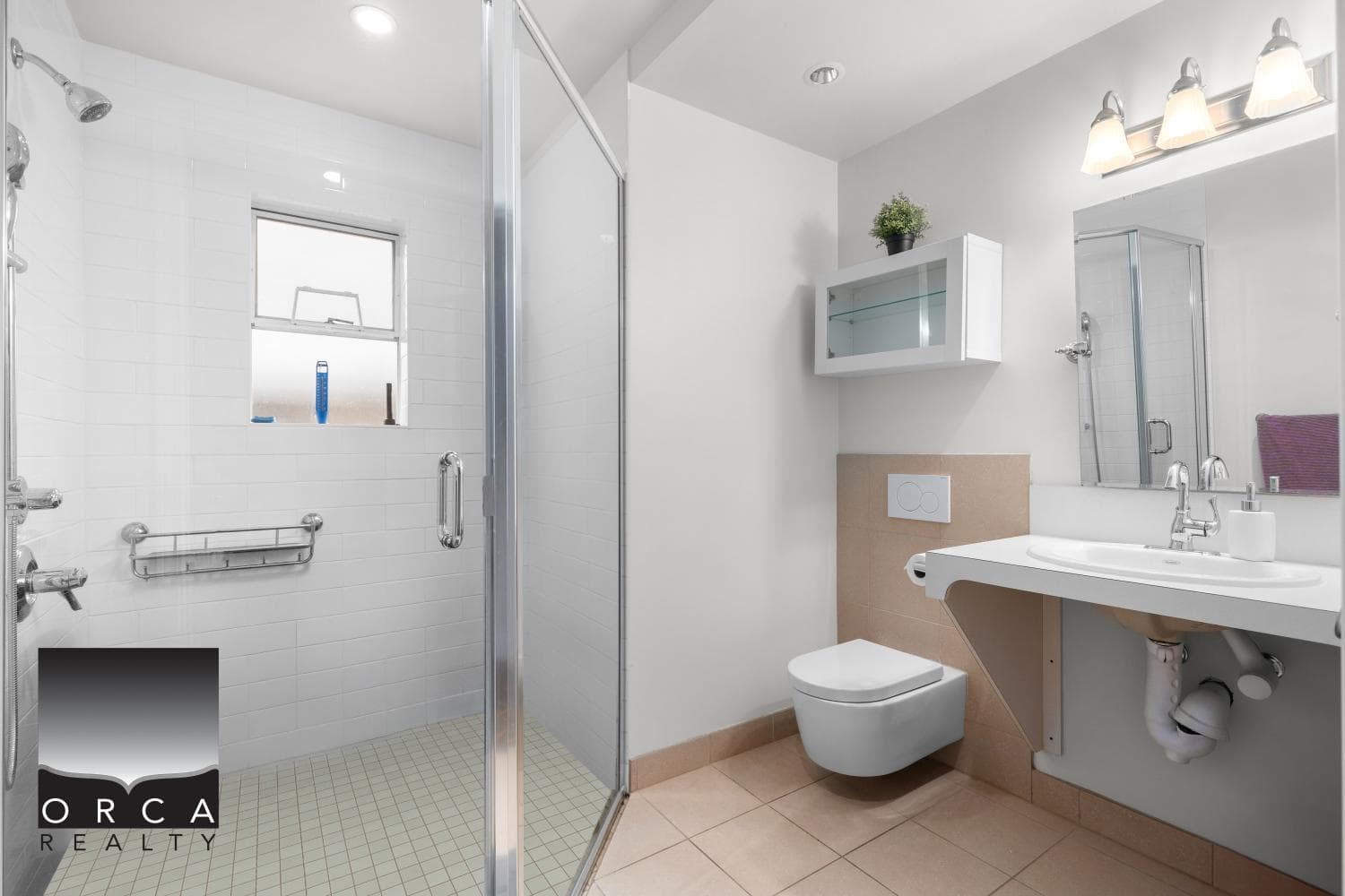 Modern bathroom with walk-in shower, white subway tiles, and contemporary fixtures. Features a wall-mounted toilet, vanity with mirror, and bright lighting, ideal for Vancouver real estate listings.