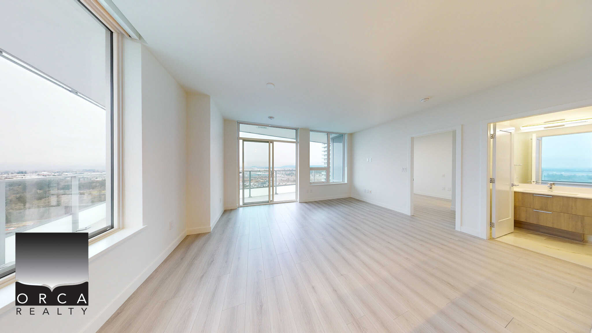 Luxurious high-rise apartment living with bright open-concept living room, large windows, and city views in Vancouver, BC.
