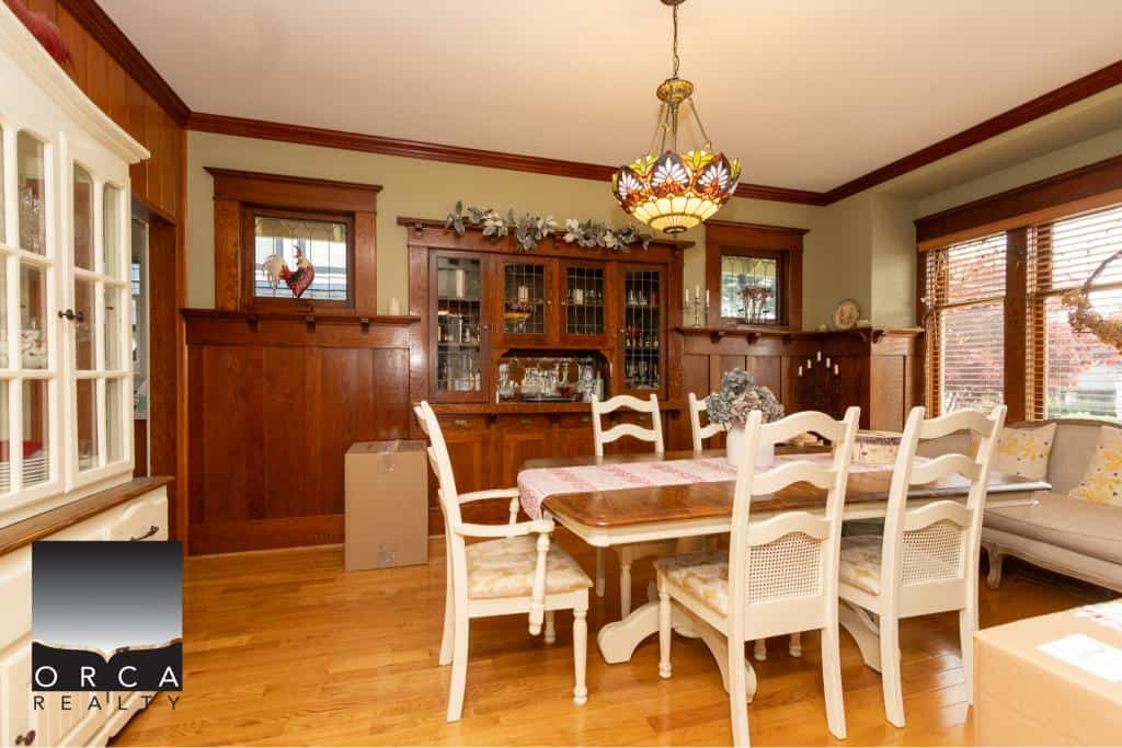 Cozy dining room with wooden accents and vintage furniture, perfect for family gatherings and entertaining guests in a charming home.