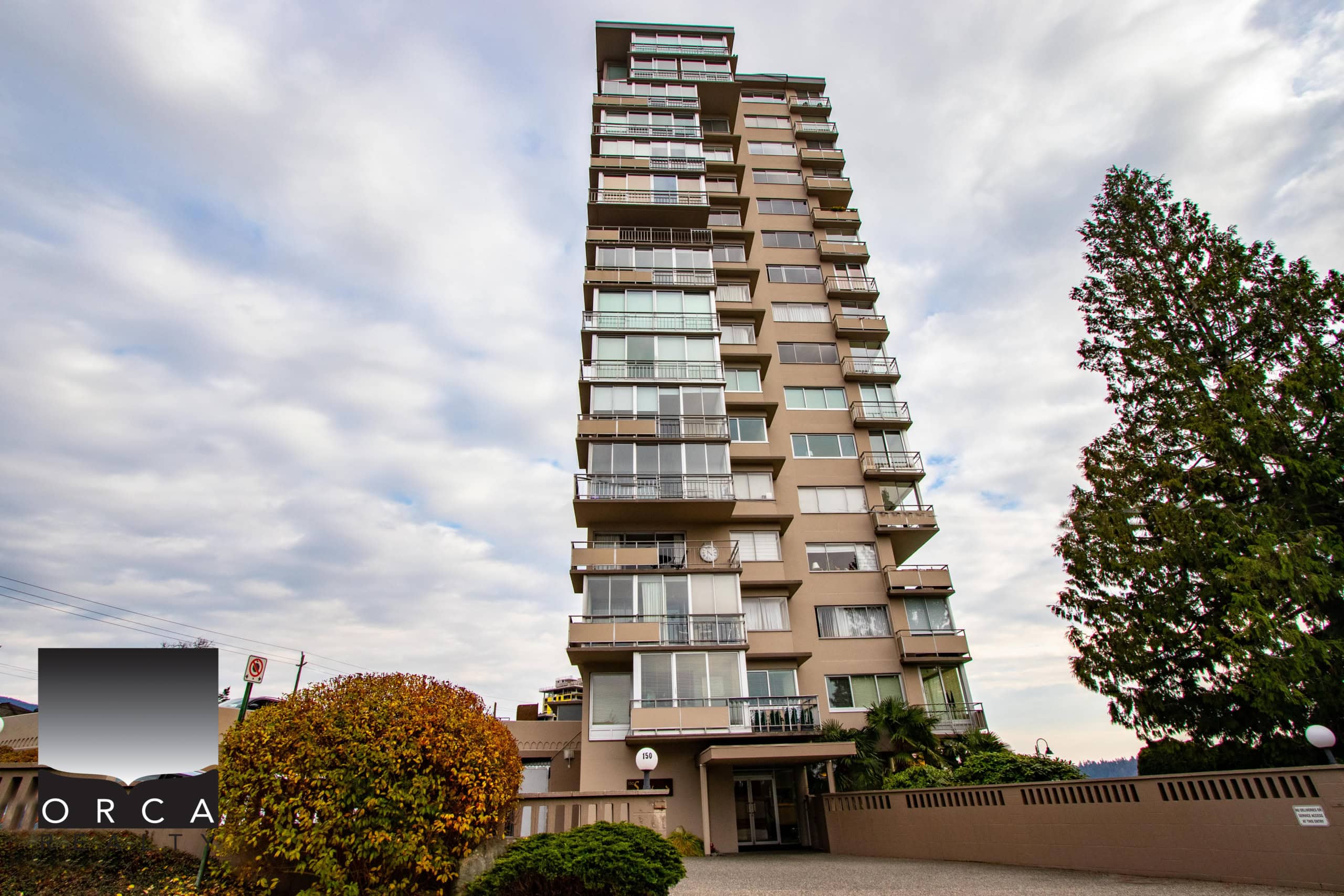 Modern high-rise condo building in Vancouver, BC, featuring spacious balconies, sleek architecture, and prime location. Perfect for urban living and investment opportunities in the real estate market.