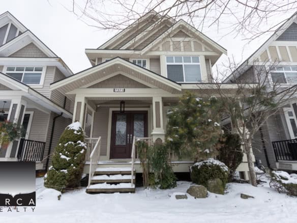 Spacious modern home with elegant exterior, front porch, and landscaped yard in a desirable neighbourhood, perfect for real estate investment and family living.