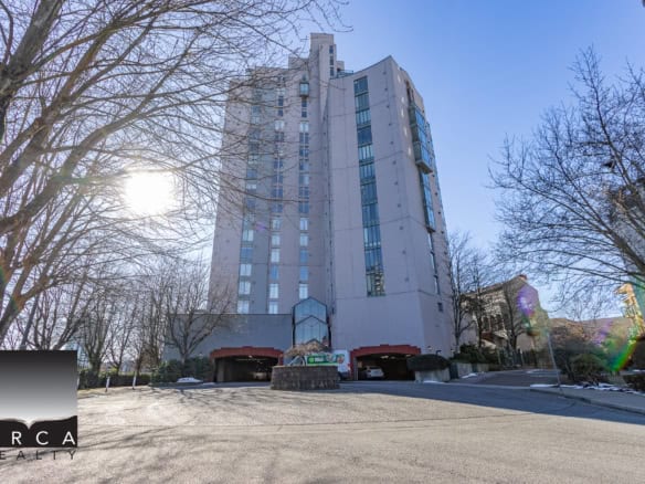 Contemporary high-rise condominium building in Vancouver, BC, with modern architecture and scenic surroundings. Perfect for real estate investment or housing needs in the Vancouver area.