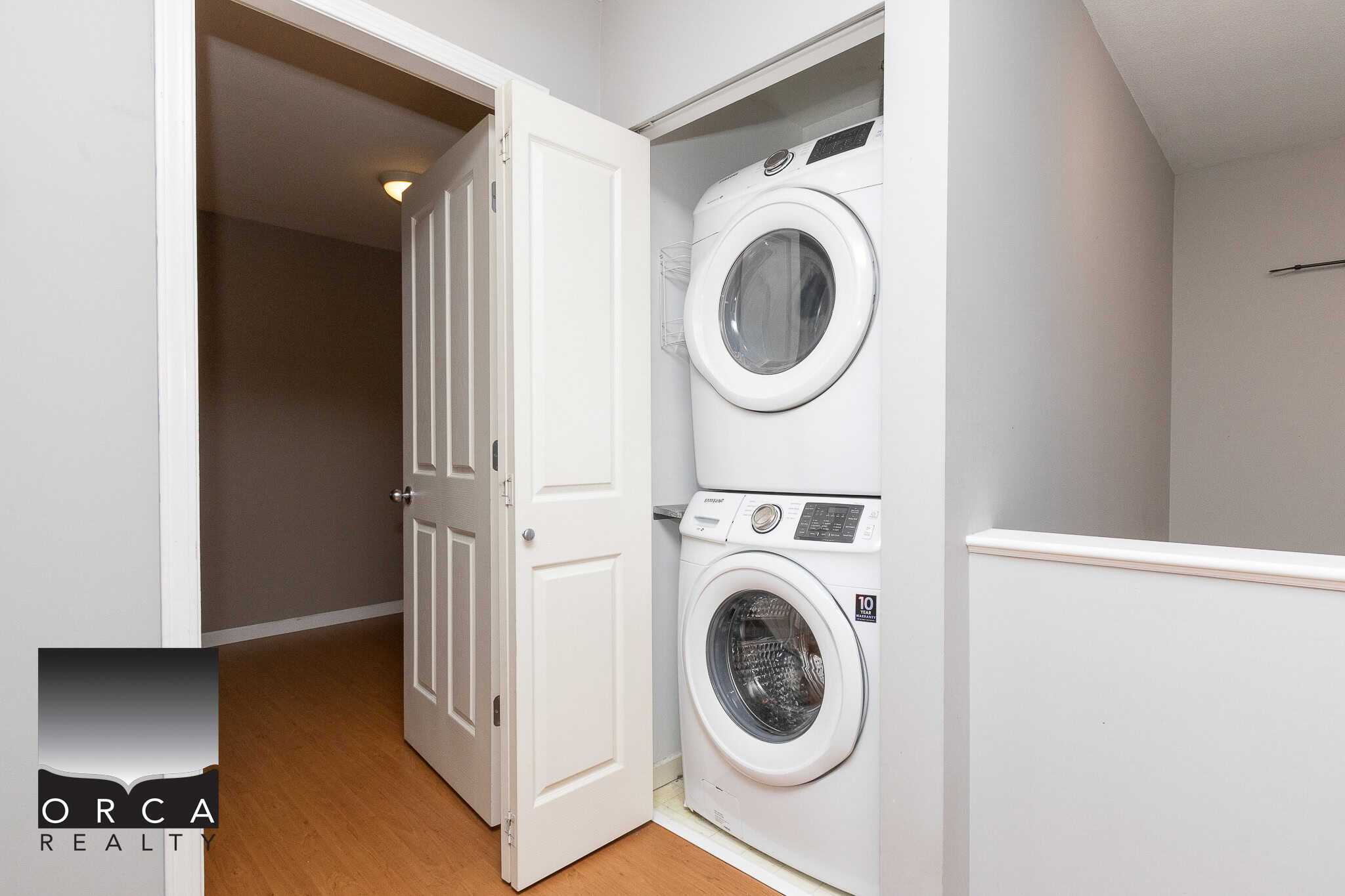 Efficient laundry area with stacked washer and dryer in a modern home, showcasing convenient laundry solutions.