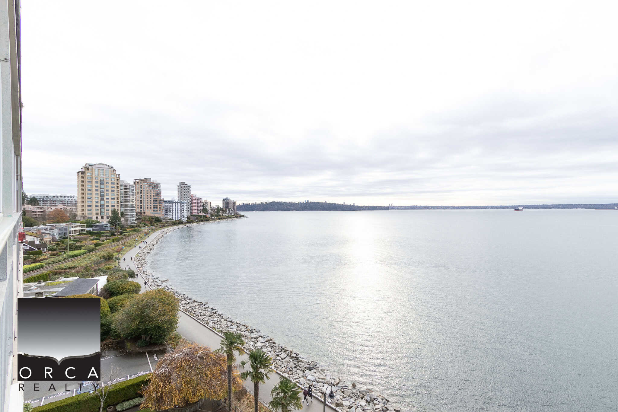 Breathtaking waterfront view of Vancouver's skyline and Burrard Inlet, showcasing luxury real estate opportunities in a prime oceanfront location.