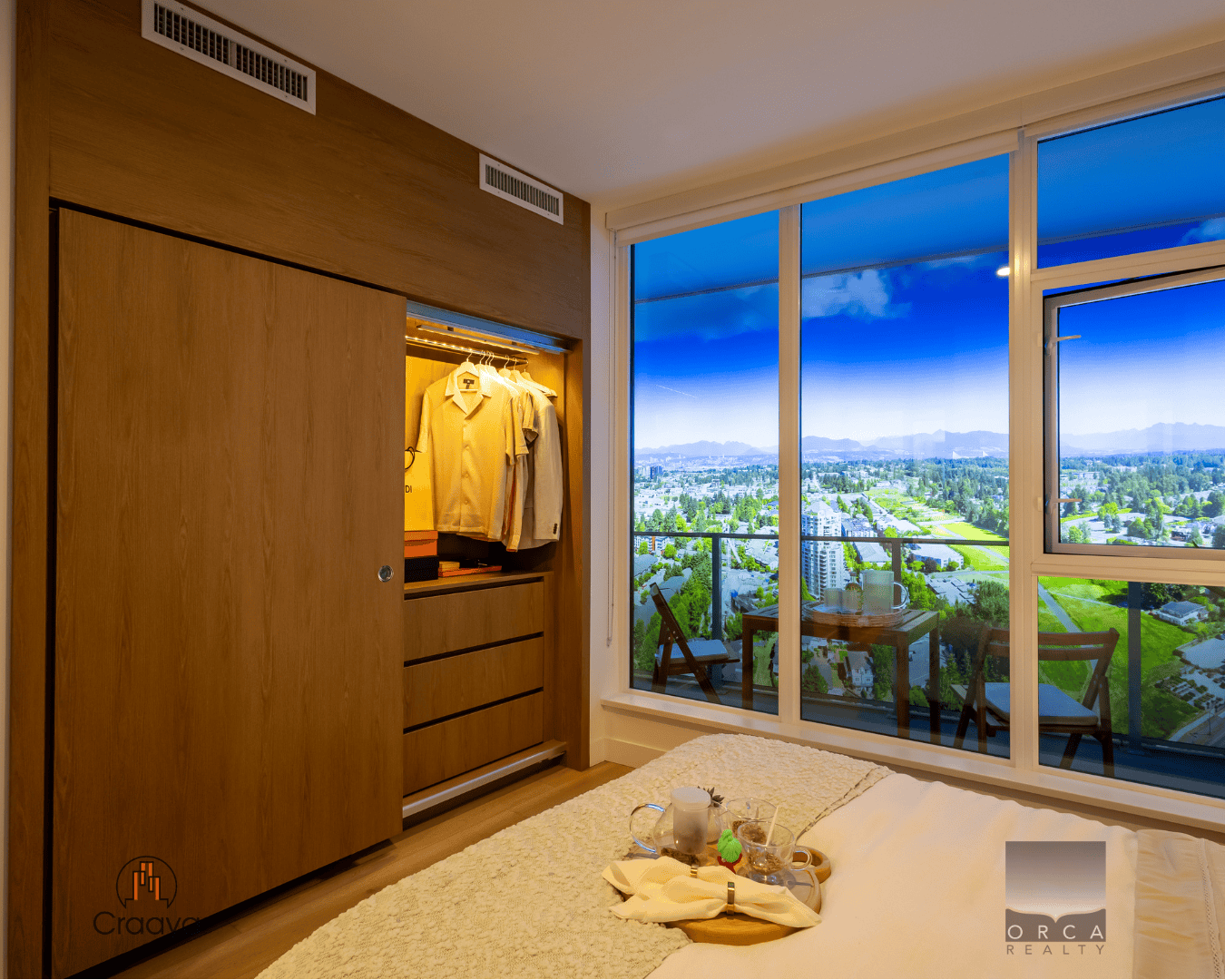 5 Modern high-rise bedroom with large windows offering panoramic city views, wooden closet, cozy bedding, and balcony for relaxation, perfect for Vancouver living.