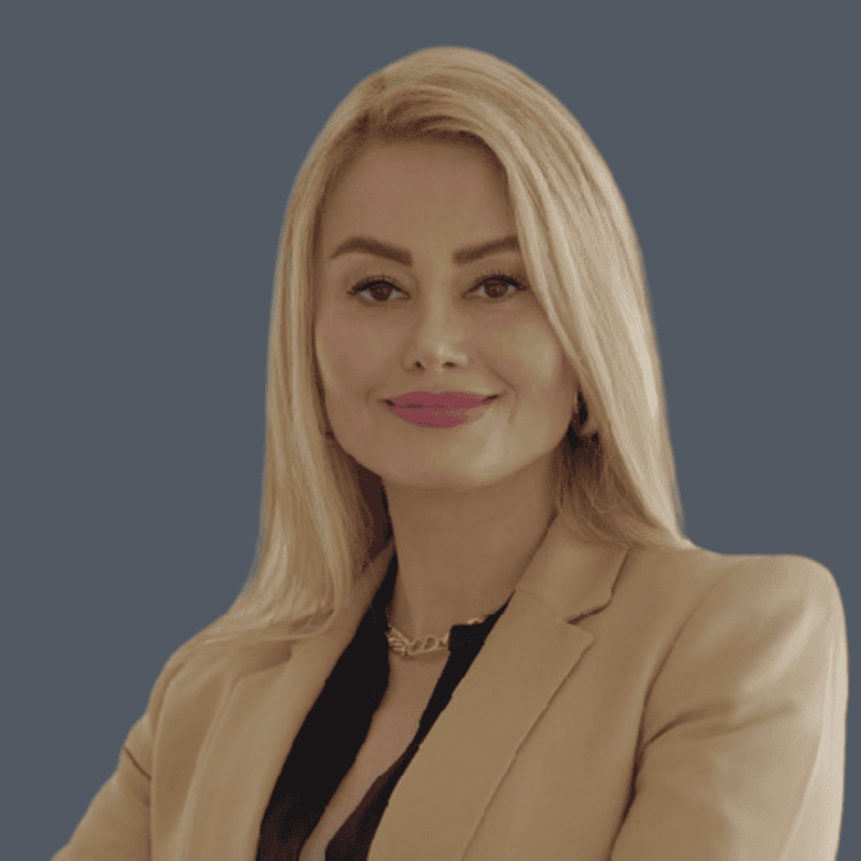 Professional real estate agent portrait, woman with blonde hair and business attire, expertise in Vancouver and Lower Mainland property market, trusted by Orca Realty Inc.