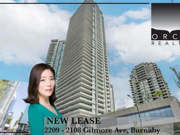 Modern high-rise apartment building with a real estate agent promoting new lease opportunities in Burnaby.