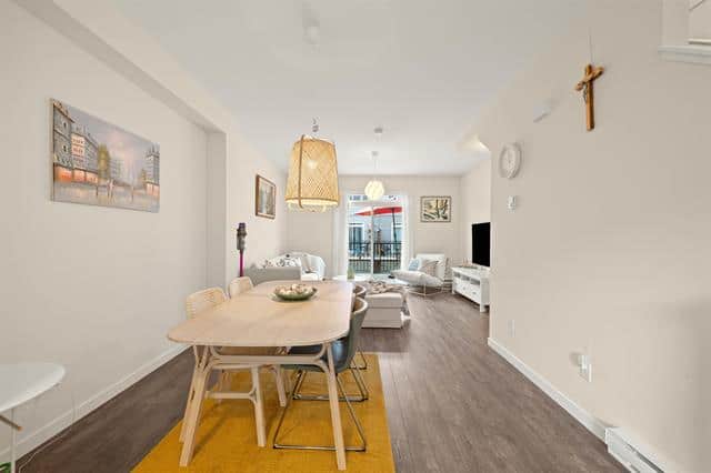 Modern downtown Vancouver condo living with open-concept dining and living space, natural light, stylish decor, and urban amenities. Perfect for real estate investment or family homes.