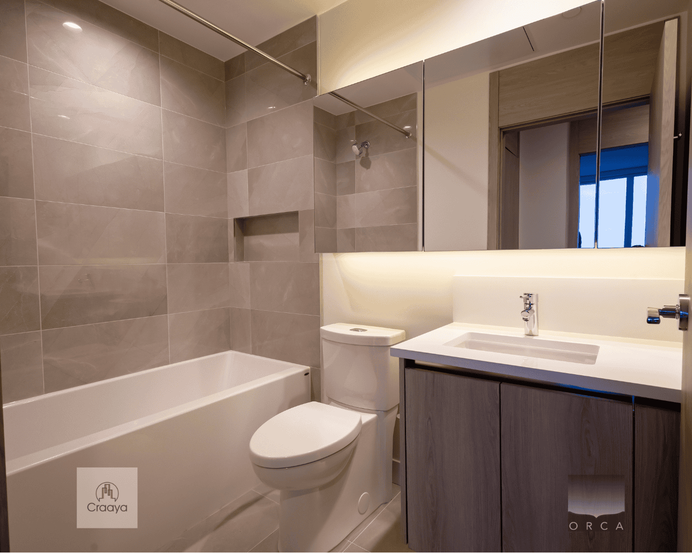 Modern bathroom interior with bathtub, toilet, and vanity with sink, featuring neutral tones and sleek design, for luxury Vancouver real estate listings by Orca Realty Inc.