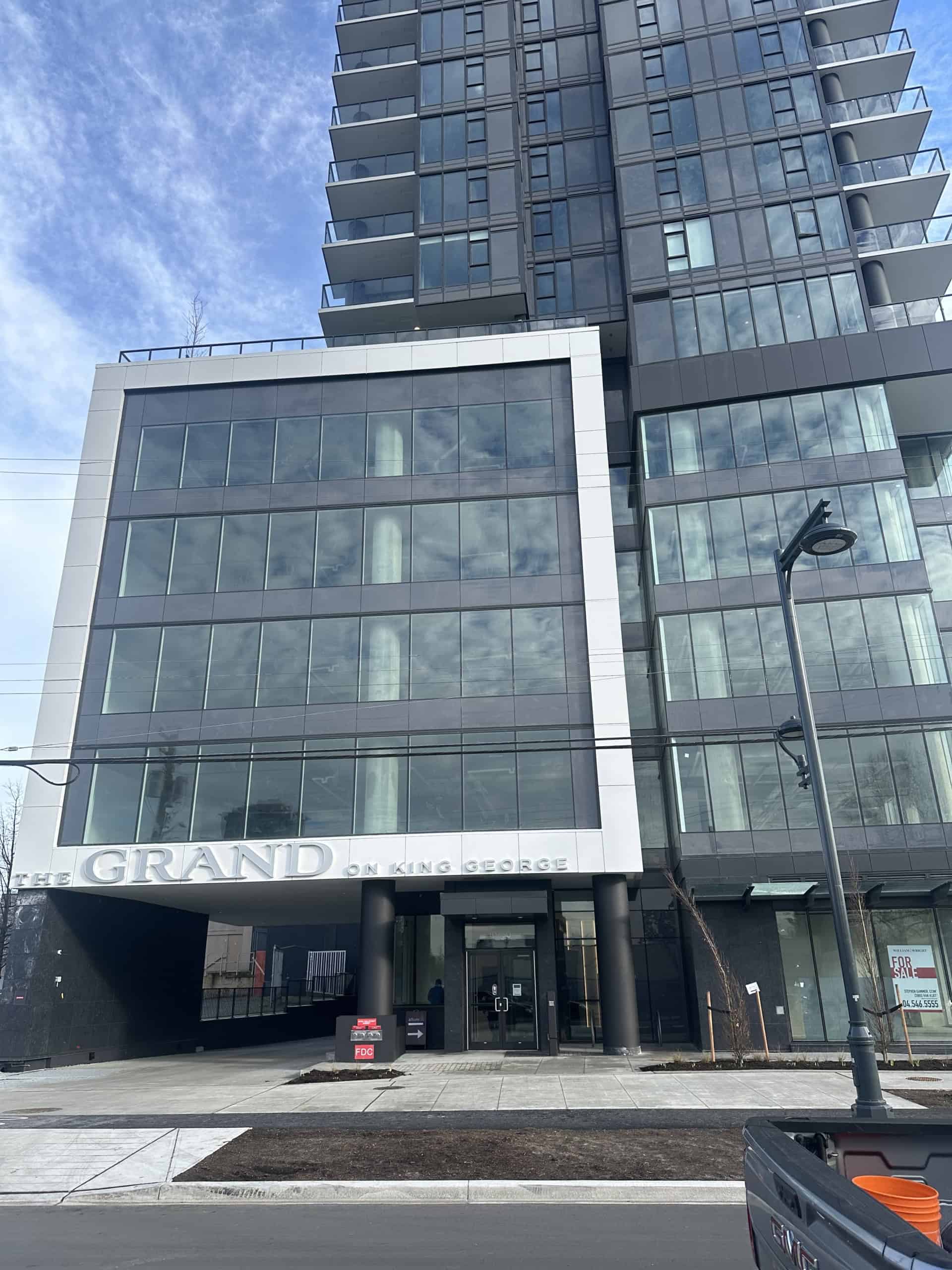 Modern high-rise condo building in Downtown Vancouver, featuring sleek glass exterior, spacious balconies, and premium urban living spaces. Ideal for real estate investors and homebuyers seeking luxury residences.
