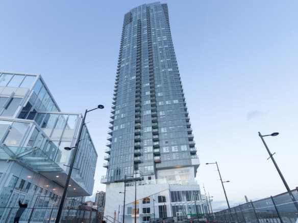 Contemporary high-rise residential building in downtown Toronto showcasing modern architecture and luxury living spaces. Ideal for real estate investments and luxury condo purchases.