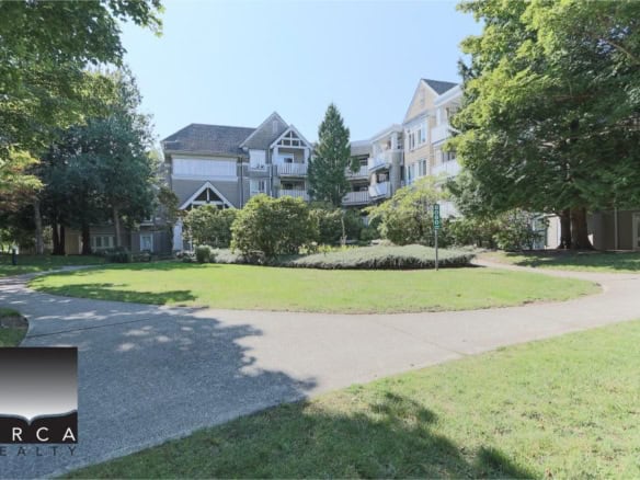 Modern multi-unit residential complex with scenic landscaped gardens and walking paths in a peaceful urban setting in Victoria, BC. Perfect for real estate investment or rental opportunities in BC.