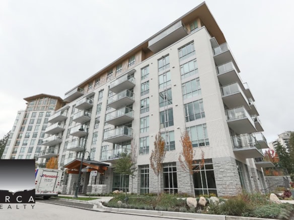 Modern condominium building in Vancouver with spacious balconies and large windows, ideal for upscale property buyers.