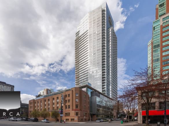 Modern high-rise condominium building with glass exterior in downtown Vancouver, BC; stylish urban living, prime location, and real estate investment opportunities.