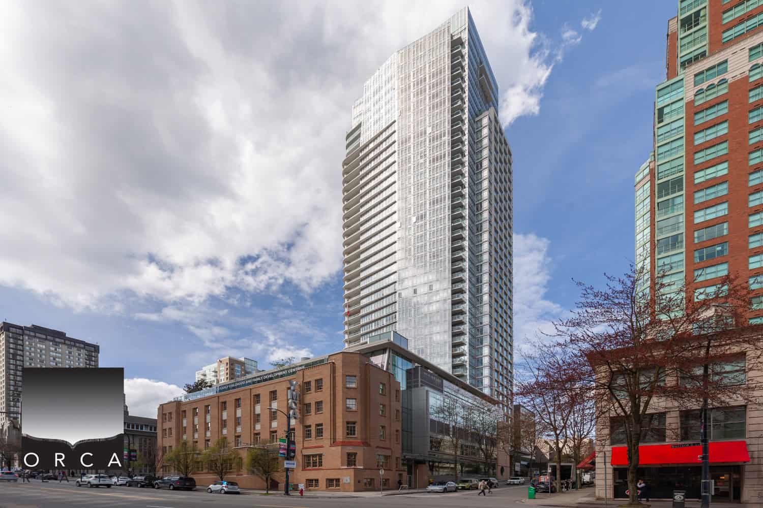 Modern high-rise condominium building with glass exterior in downtown Vancouver, BC; stylish urban living, prime location, and real estate investment opportunities.