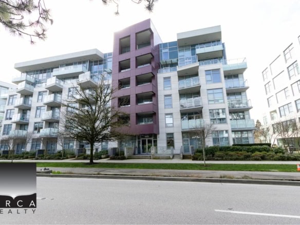 Contemporary multi-family residential apartment building with modern architecture, glass balconies, and lush landscaping in Vancouver, BC. Ideal for real estate investment and property management in British Columbia.