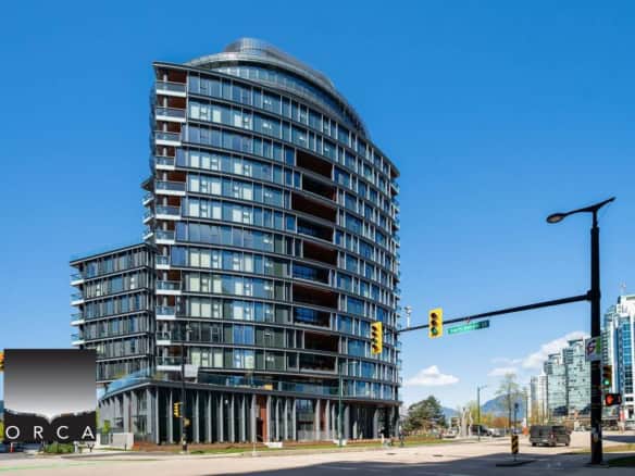 Modern high-rise condominium building in Vancouver, BC, showcasing contemporary architecture, luxury residences, and prime real estate opportunities. Perfect for property buyers and investors.