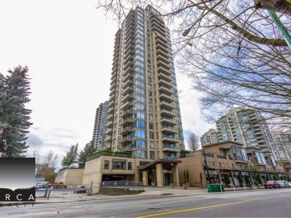 Luxurious high-rise condominium building with modern architecture and spacious balconies in downtown Vancouver, offering panoramic city views and proximity to amenities.