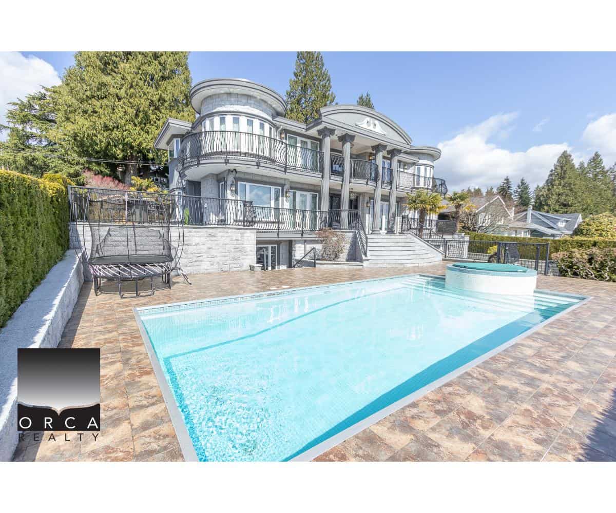 Elegant luxury waterfront home with ocean views, private pool, hot tub, and expansive outdoor entertaining area in British Columbia. Perfect for upscale real estate investment.