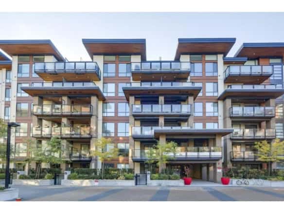 Luxury modern multi-unit residential building with spacious balconies and contemporary design in Vancouver, BC. Perfect for urban living and investment opportunities.