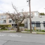 Modern multi-family apartment building in Vancouver with contemporary design and landscaped outdoor spaces.