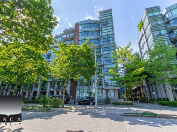 Modern glass condominium buildings surrounded by lush green trees in Vancouver’s urban centre. Perfect for real estate investment or living in a vibrant, scenic community.