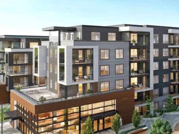 Modern multi-story condominium building with spacious balconies, contemporary exterior design, and lush landscaping, offering luxury residential living and real estate opportunities in the Vancouver area.