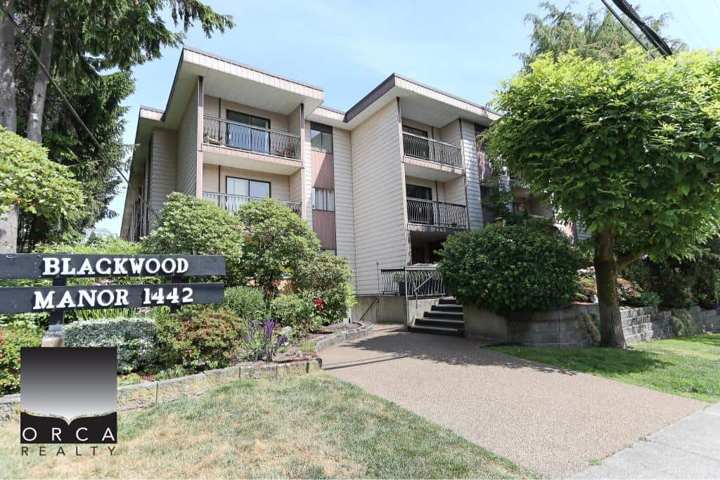 Spacious multi-family residential building at 1442 Blackwood Manor, Vancouver, BC, surrounded by lush greenery, perfect for real estate investment and property management in British Columbia.