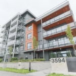Modern multi-family residential building in Vancouver, BC with sleek balconies and contemporary design elements.