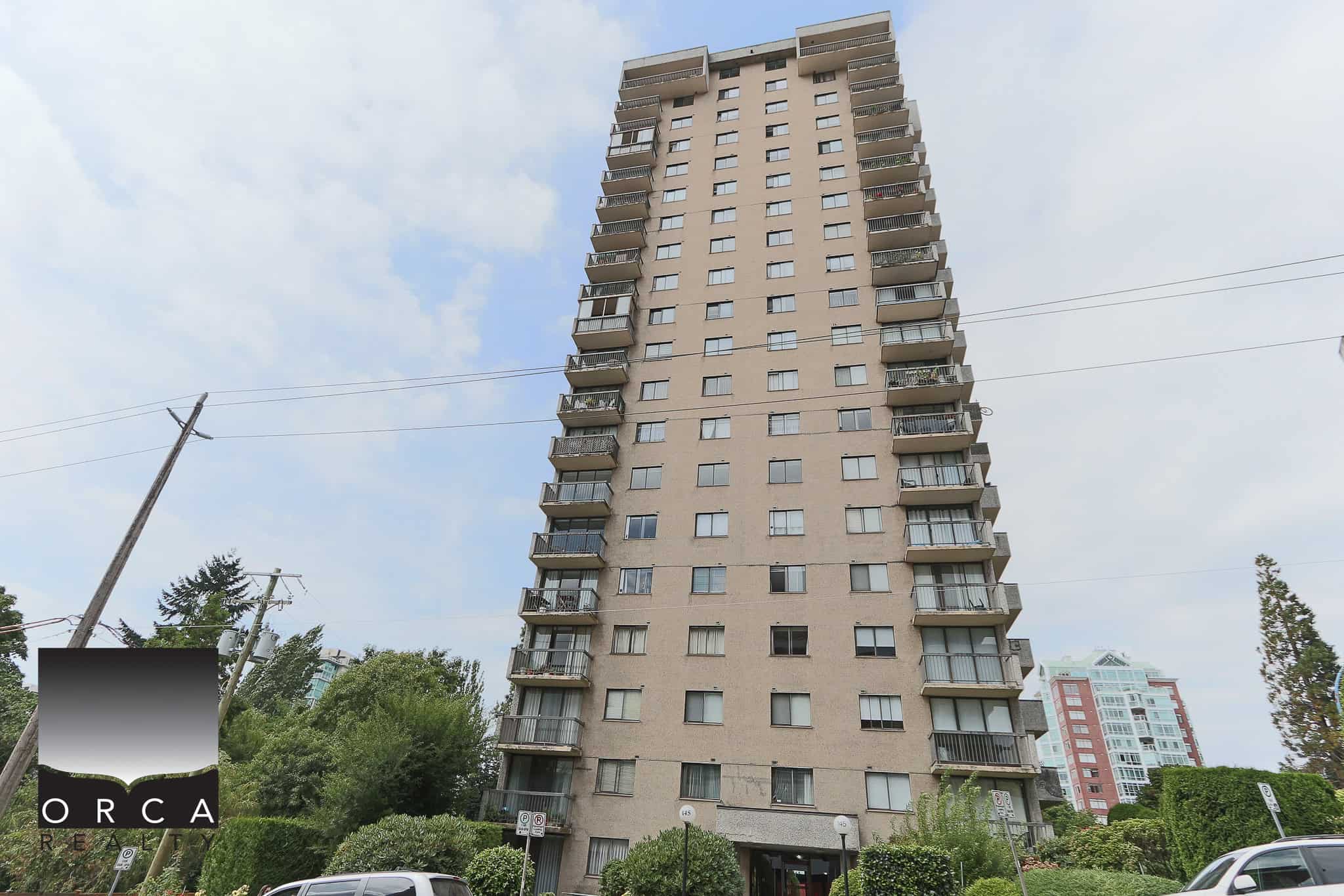 Modern high-rise residential building in Vancouver with multiple balconies and large windows, near parks and amenities, ideal for Vancouver real estate investment and living.