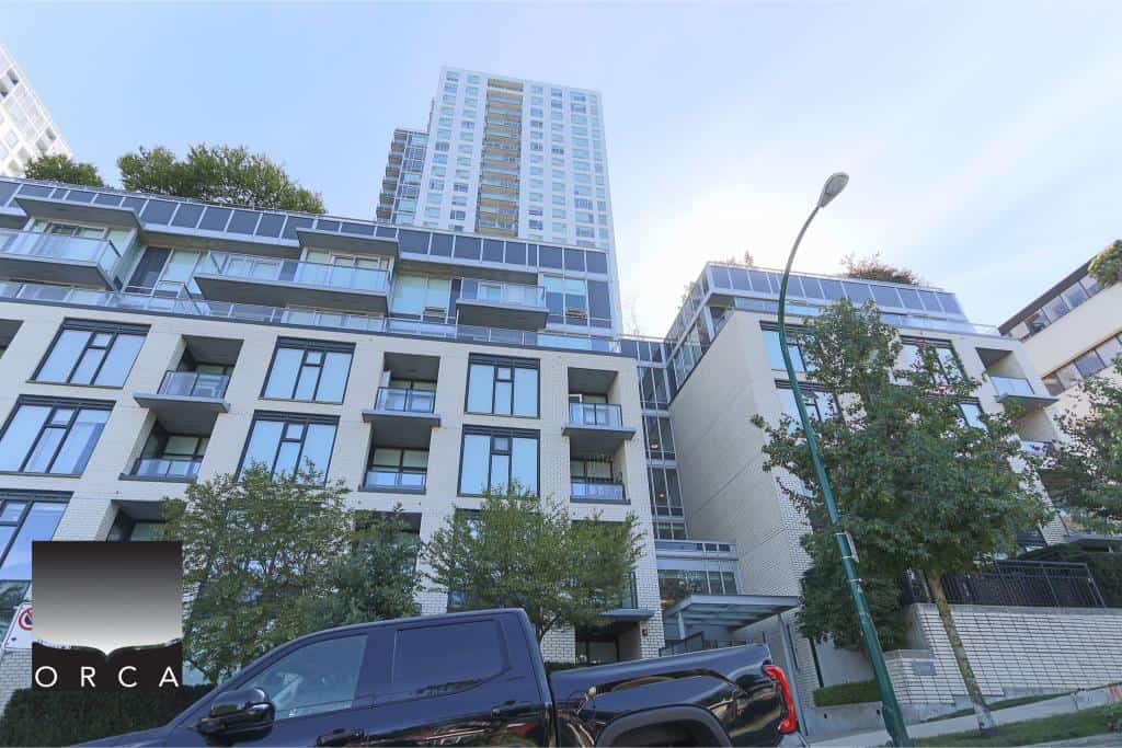 Contemporary high-rise residential building in Vancouver, showcasing modern apartment units with large windows and balconies, ideal for urban living and real estate investment in British Columbia.