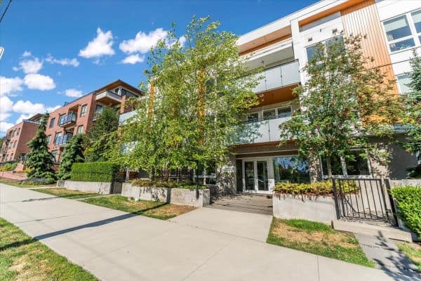 Contemporary residential building at 101-7878 Granville Street, Vancouver, featuring stylish architecture, green spaces, and urban living amenities.
